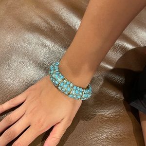 Stretchy gold bracelet with pretty blue oval stones. So pretty-  dresses you up